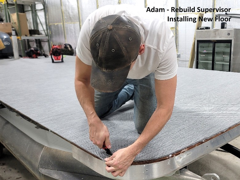 staff member adam installing a new floor to a pontoon boat