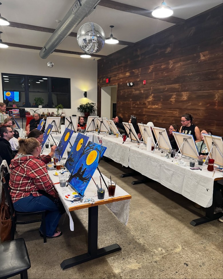 people painting in a room