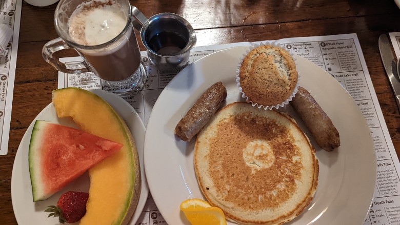breakfast items with coffee and syrup