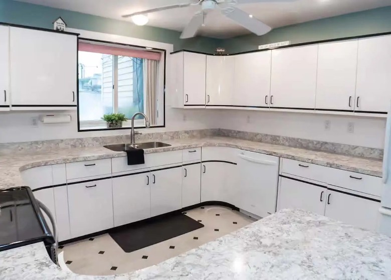 large kitchen space with white cabinets
