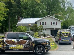 house with topgen roofing truck in front