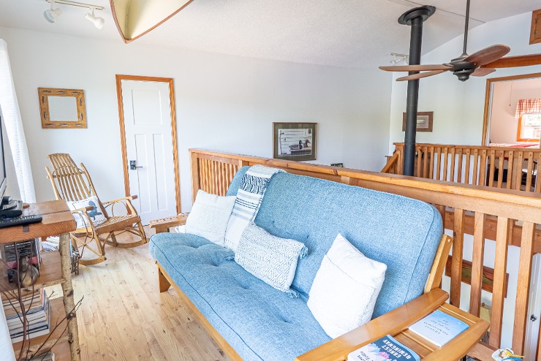The loft area provides additional space and a full sized futon for additional sleeping options