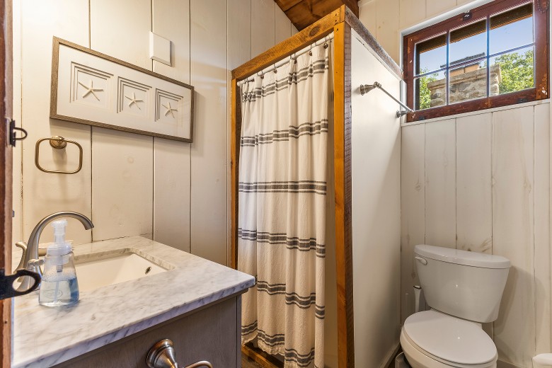 Upstairs bathroom with a stand-up shower.
