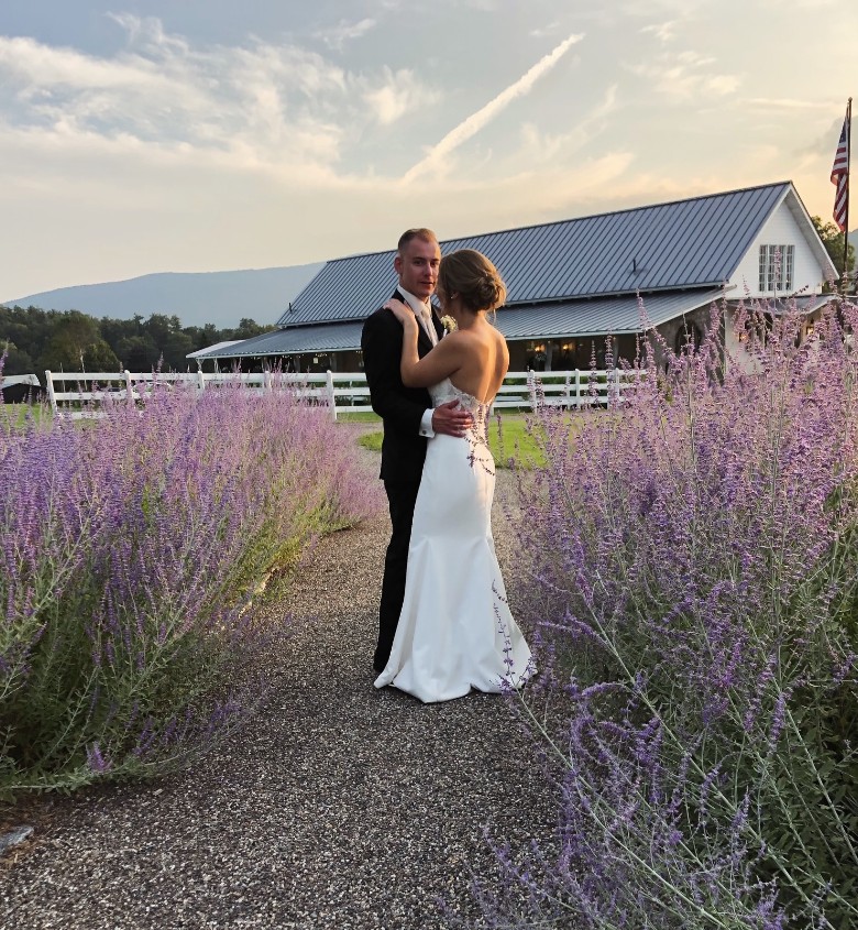 bride and groom embracing in a lavender field