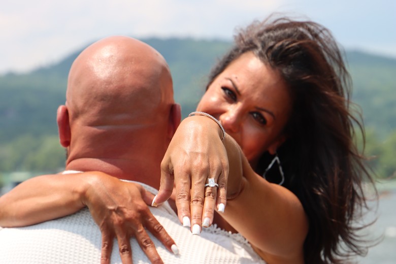 bride holding out hand with a ring