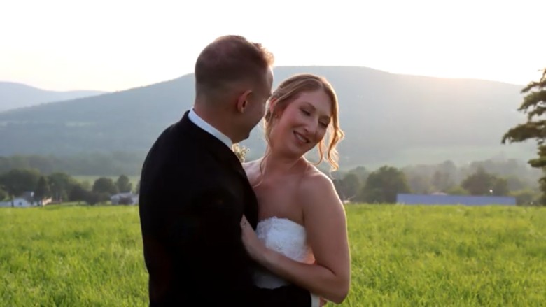 bride and groom embracing outdoors