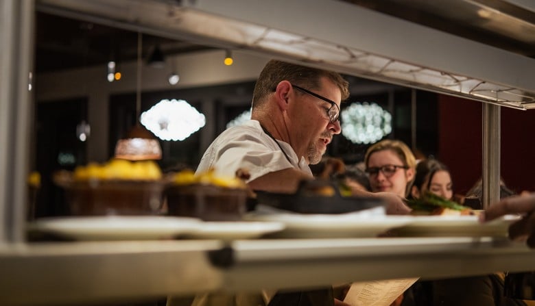 a chef delivering food
