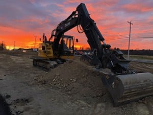 excavator at sunset