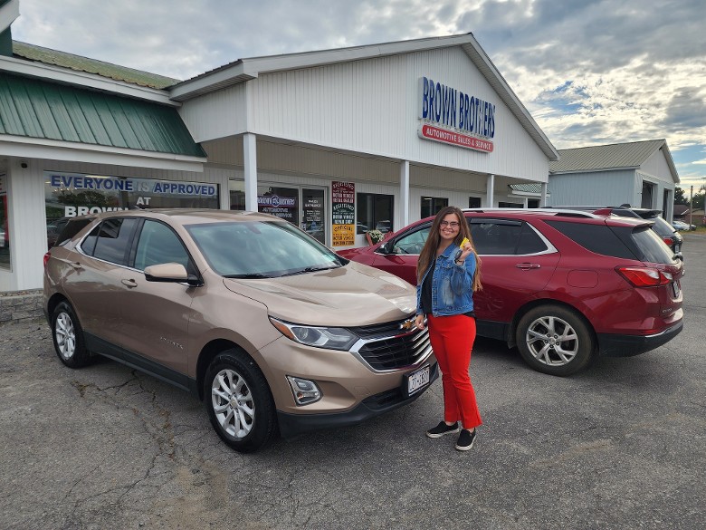 woman by car she just bought