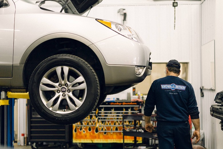 man by car in shop