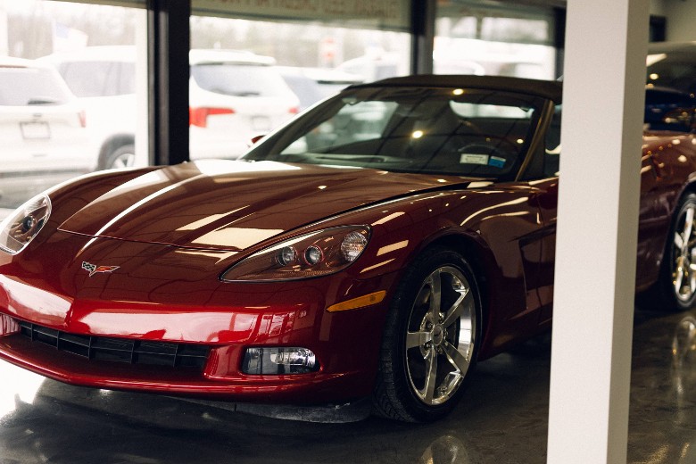 dark red car inside showroom