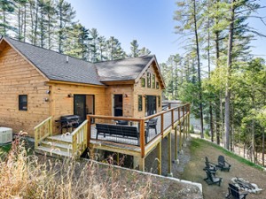 Exterior of a rustic home on a scenic hill