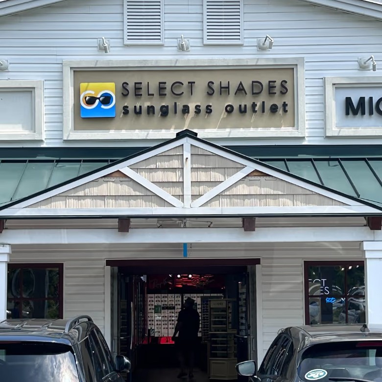 large sign above entrance to Select Shades Sunglasses Outlet