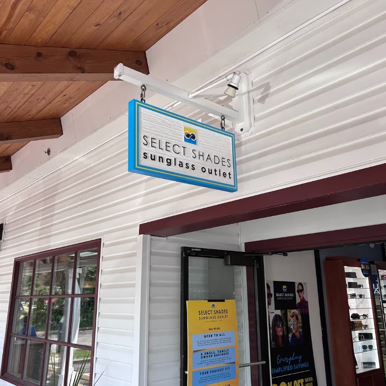 sign outside of Select Shades Sunglasses Outlet