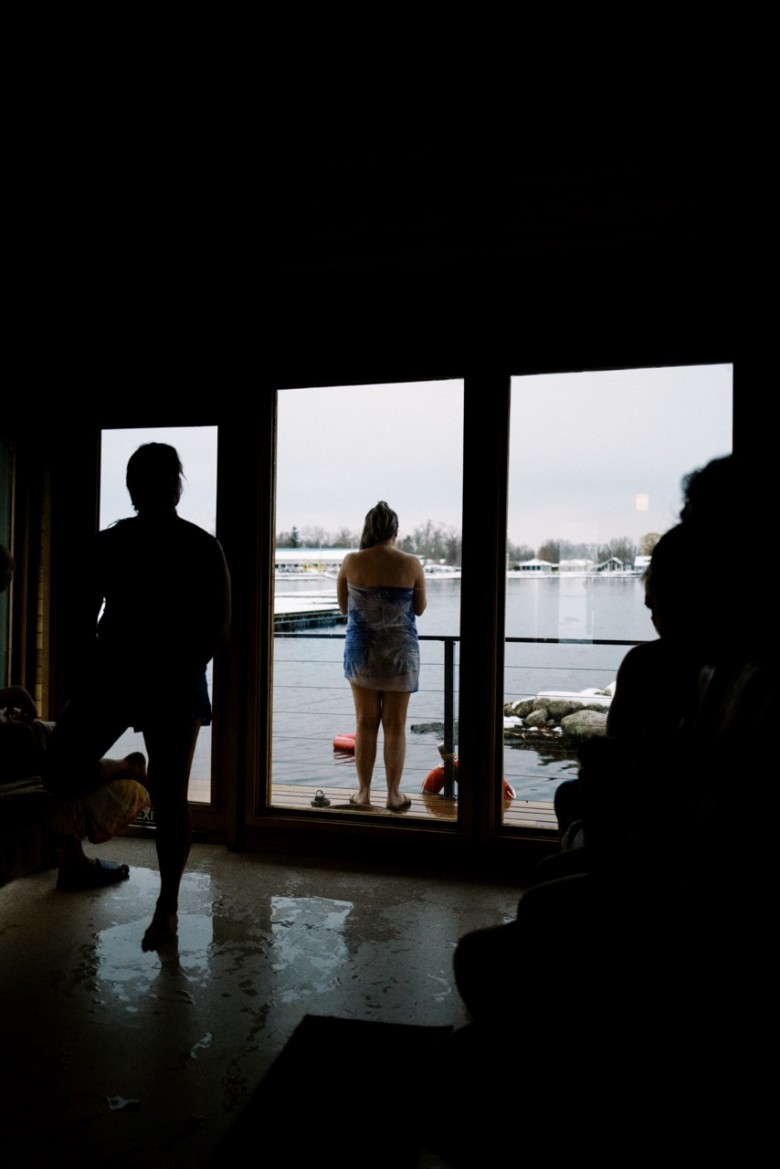 people in a floating sauna