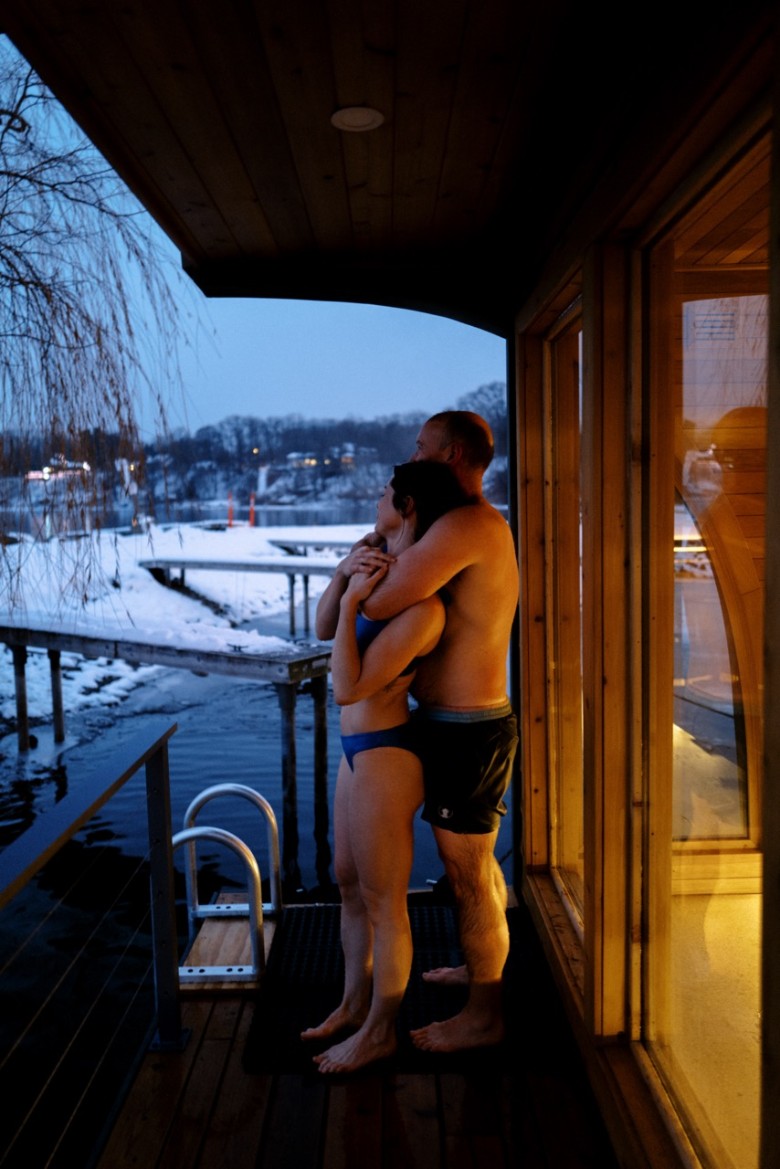 two people embracing outside a sauna