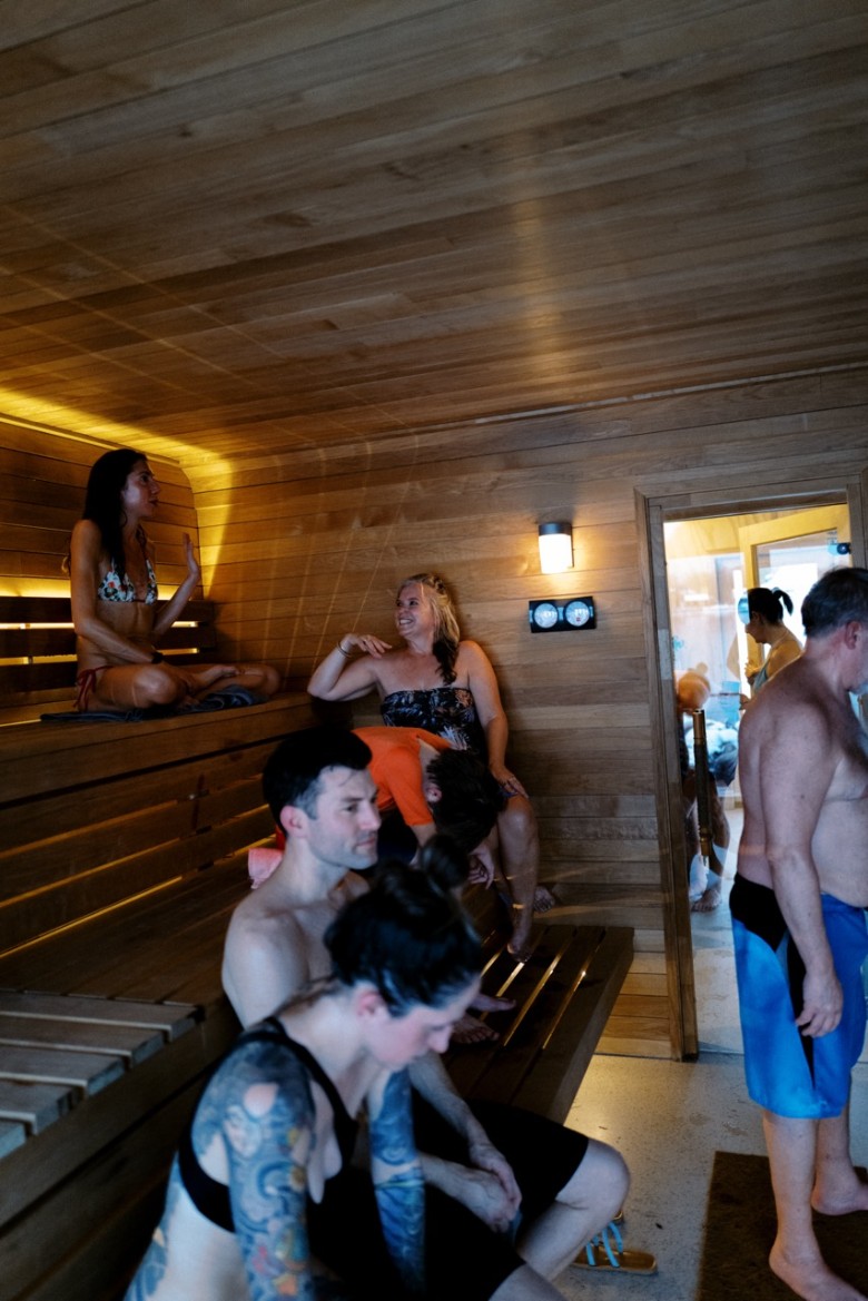 people in a floating sauna