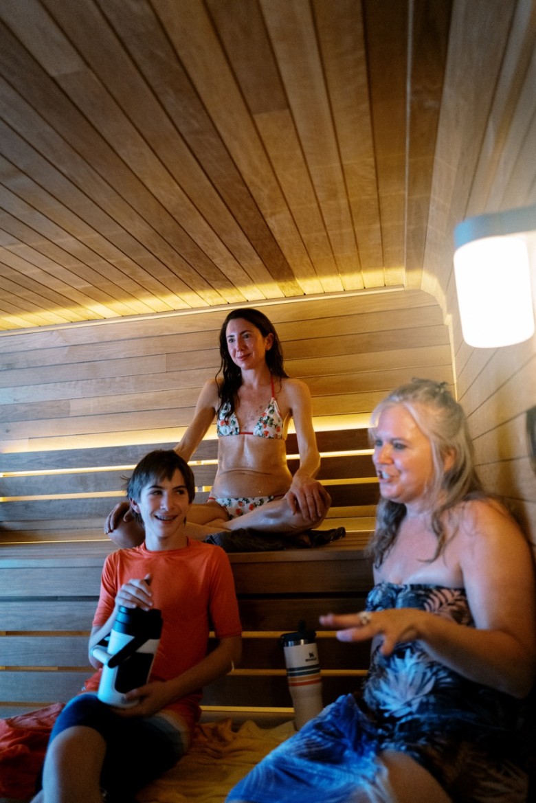 people in a floating sauna