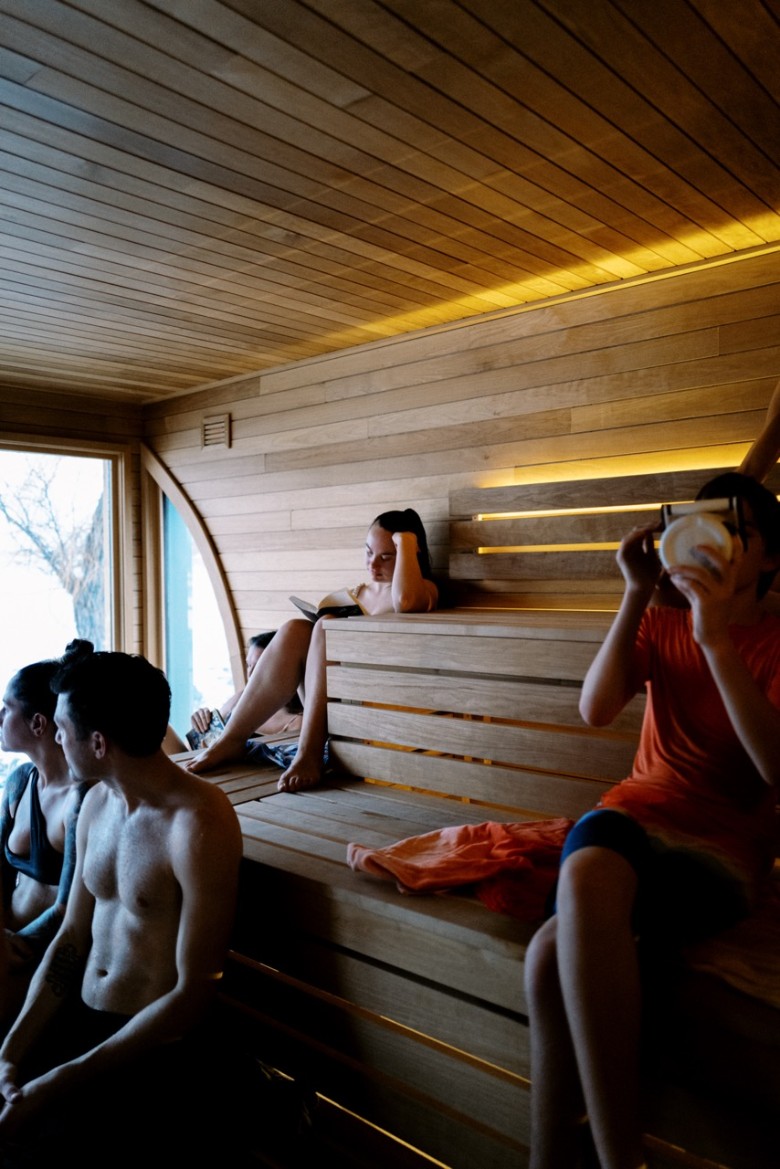 people in a floating sauna