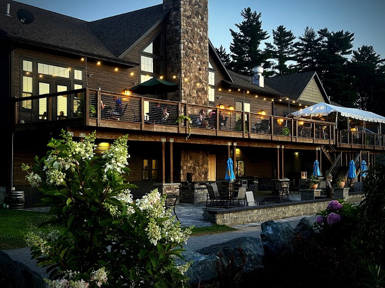 exterior of a two story restaurant with patio