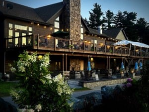 exterior of a two story restaurant with patio and deck seating