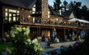 exterior of a two story restaurant with patio and deck seating