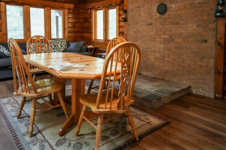 table with four chairs in a cabin