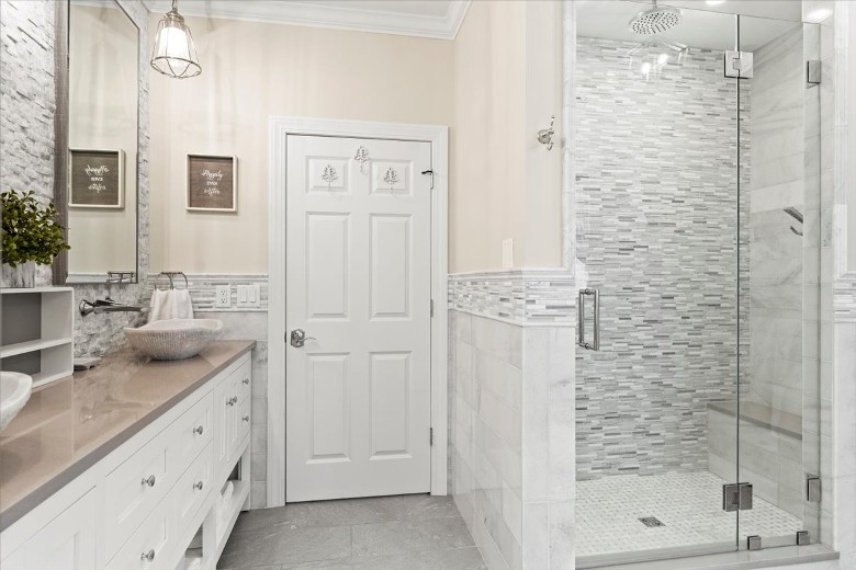 Master bathroom with double sinks, large shower and tub.