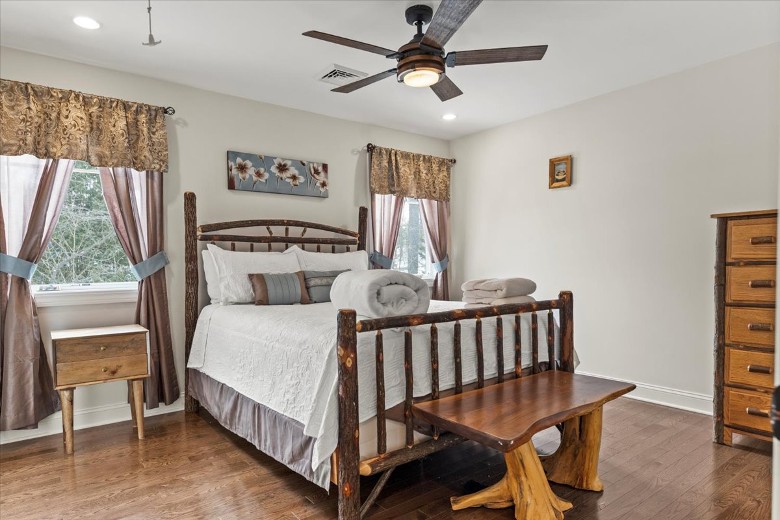 Second level bedroom with a queen bed.