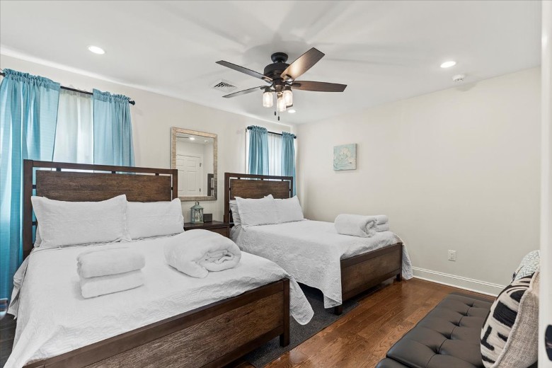 Second level bedroom with two full beds.