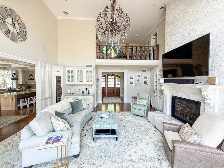 Living room with fireplace and lake views