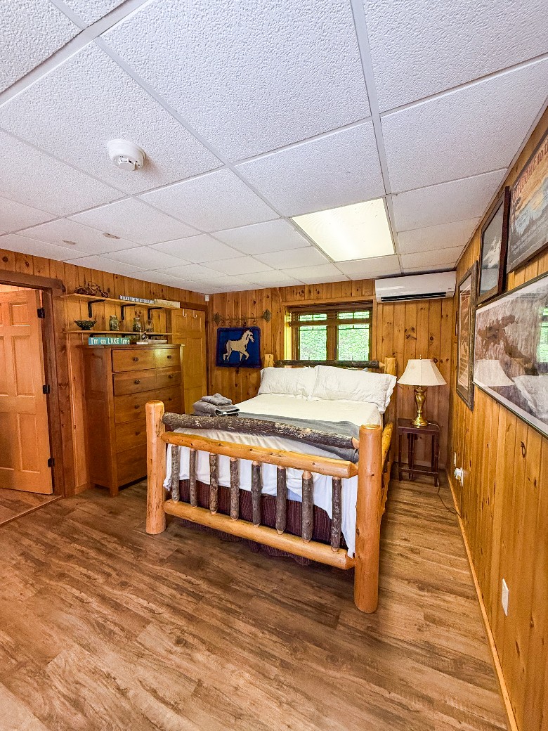 This waterfront Lake George vacation property also includes a charming guest house, complete with a kitchenette, queen bed, two twin-over-twin bunk beds, and a full bathroom&mdash;ideal for extended family or added privacy.