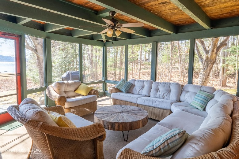an enclosed porch with furniture