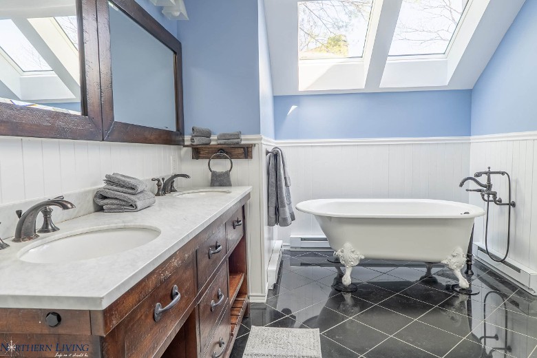 a bathroom with a bathtub and sink area