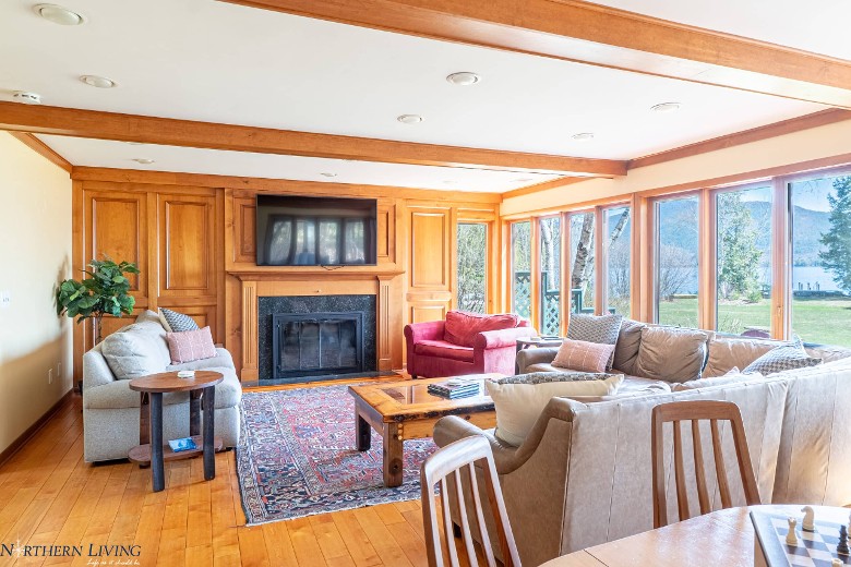 spacious living room with furniture and a fireplace