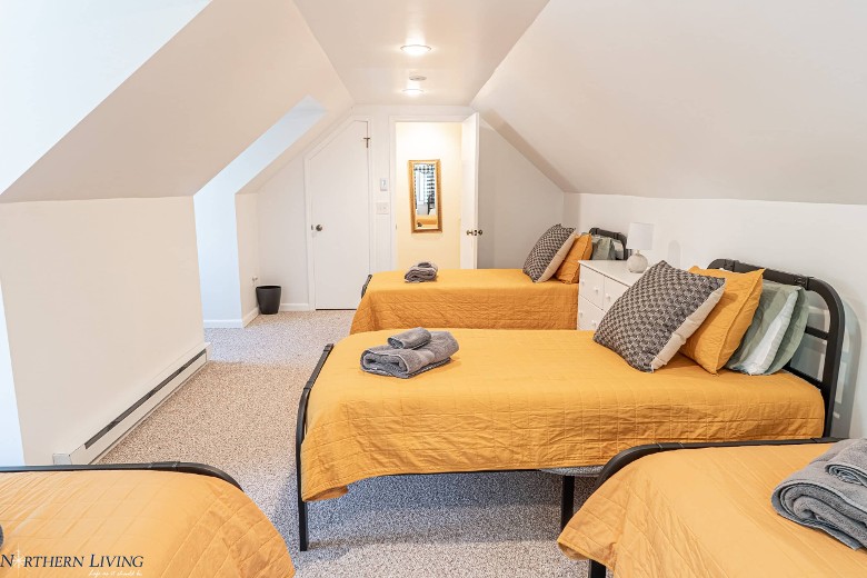 bedroom with single beds with yellow covers