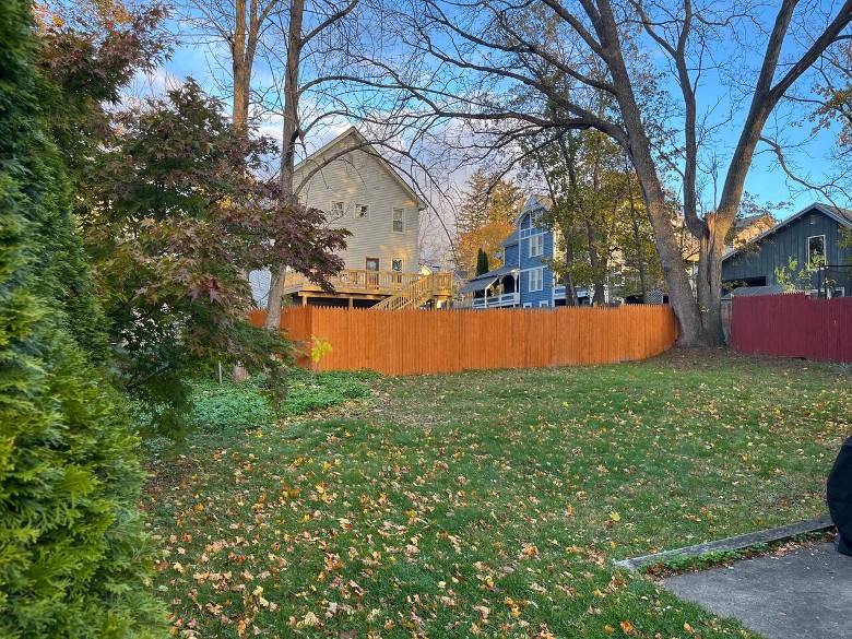 a backyard of a house in a residential neighborhood