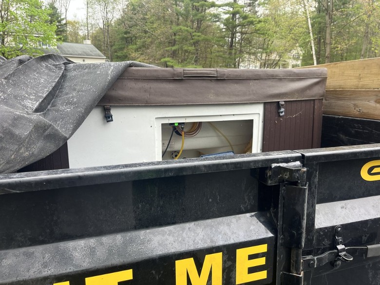 a dumpster with old structure inside it
