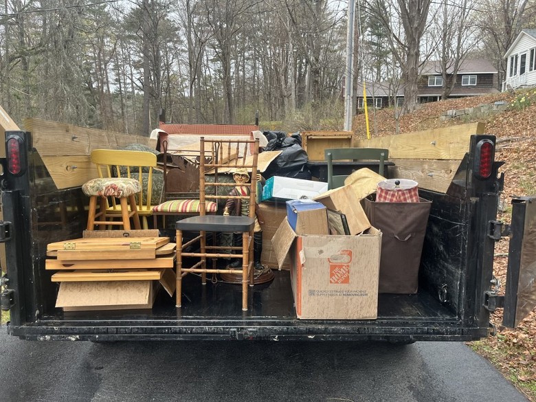 a dumpster filled with residential objects