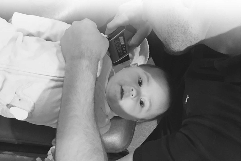 a chiropractor checking on an infant