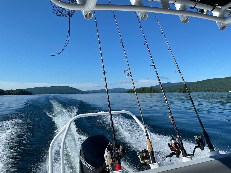 back of a boat with fishing poles