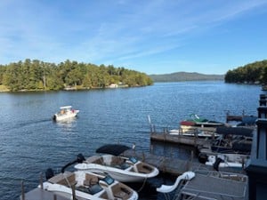a boat heading out on a lake from a docking area