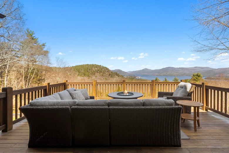 couch and fire pit on deck outside