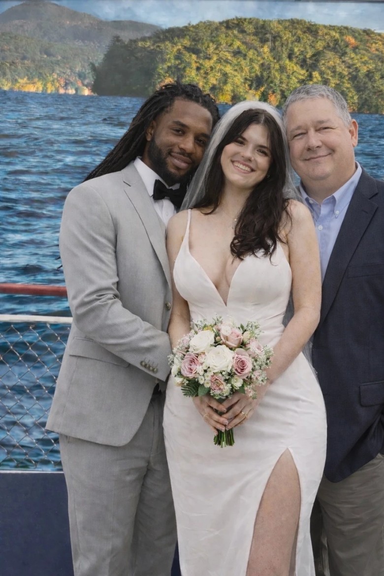 wedding officiant with couple on a boat