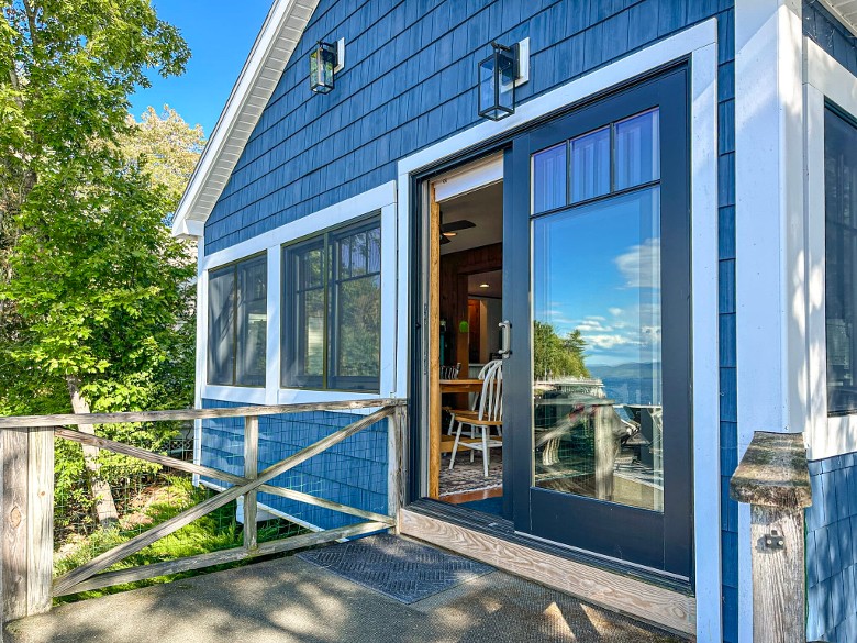 outside of a blue house and sliding glass door