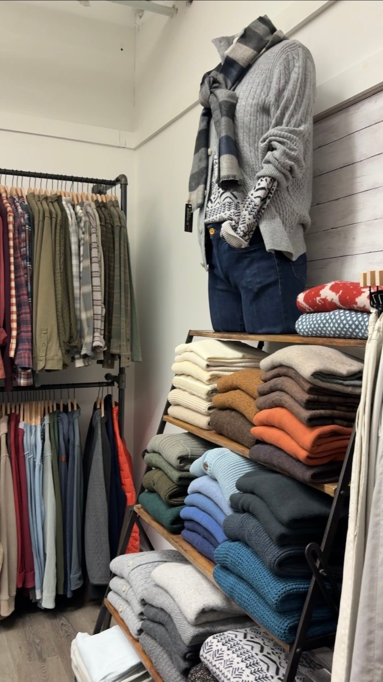 folded sweaters in a store