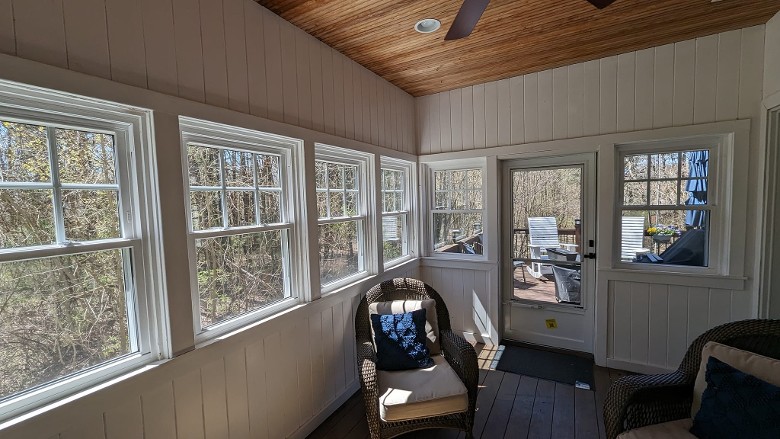 new windows and doors in a sun room with white walls