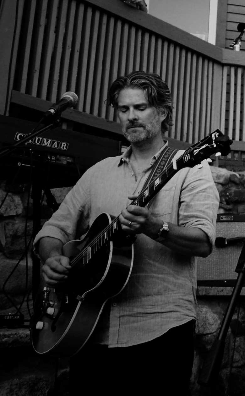 a man playing the guitar