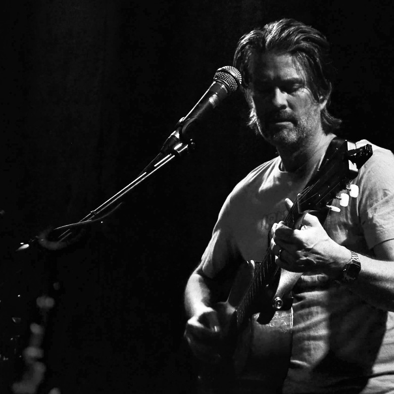 a man playing the guitar
