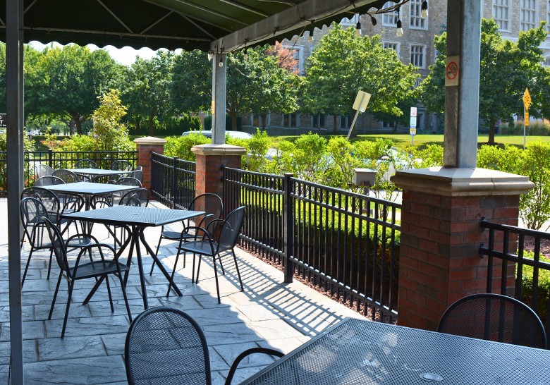 steel tables and chairs on a restaurant patio
